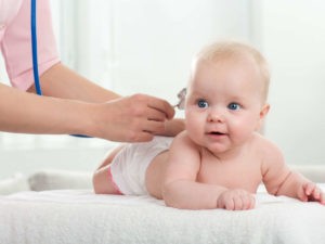 pediatrician inspection of little baby